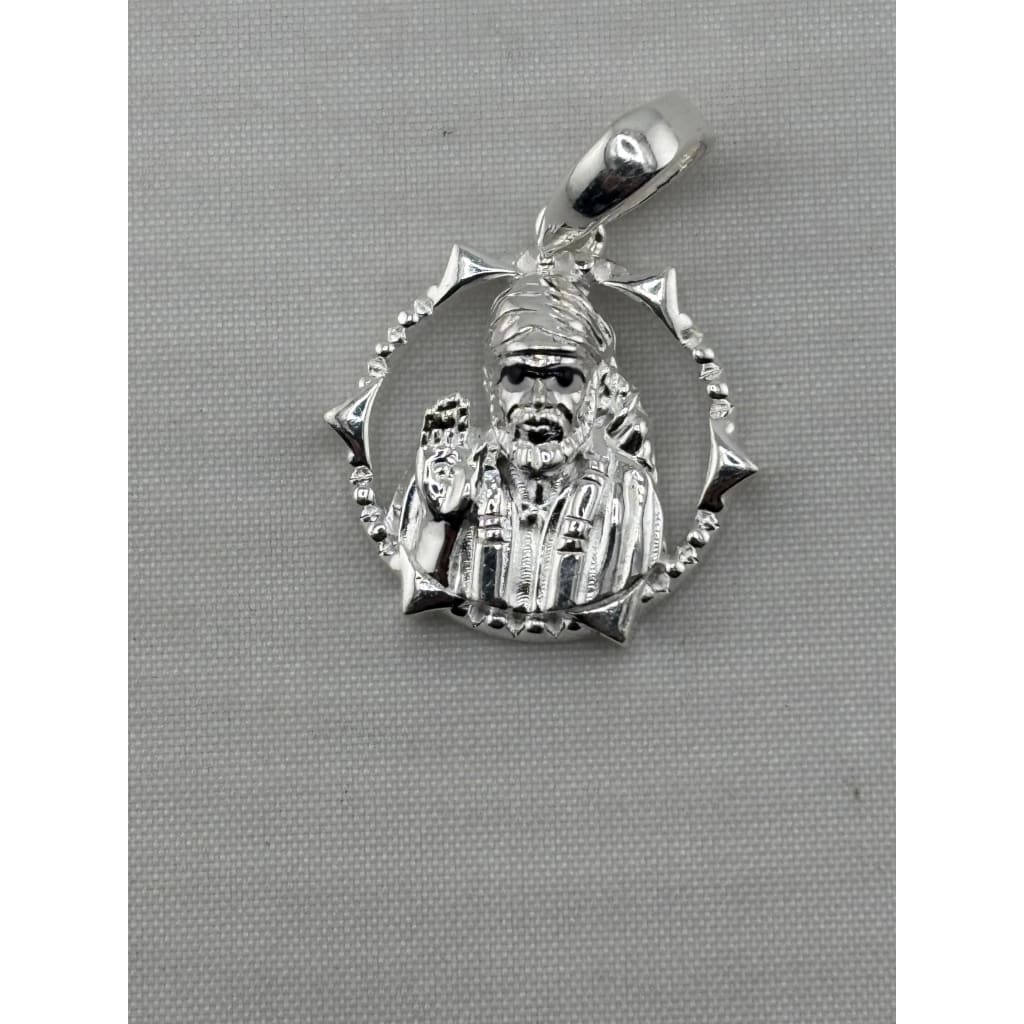 Close-up of the circular Sai Baba sterling silver pendant