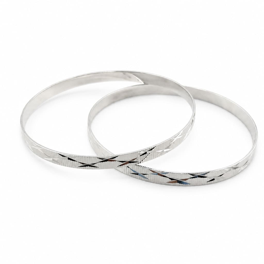 Pair of 925 sterling silver diamond-cut bangle bracelets, 63 mm