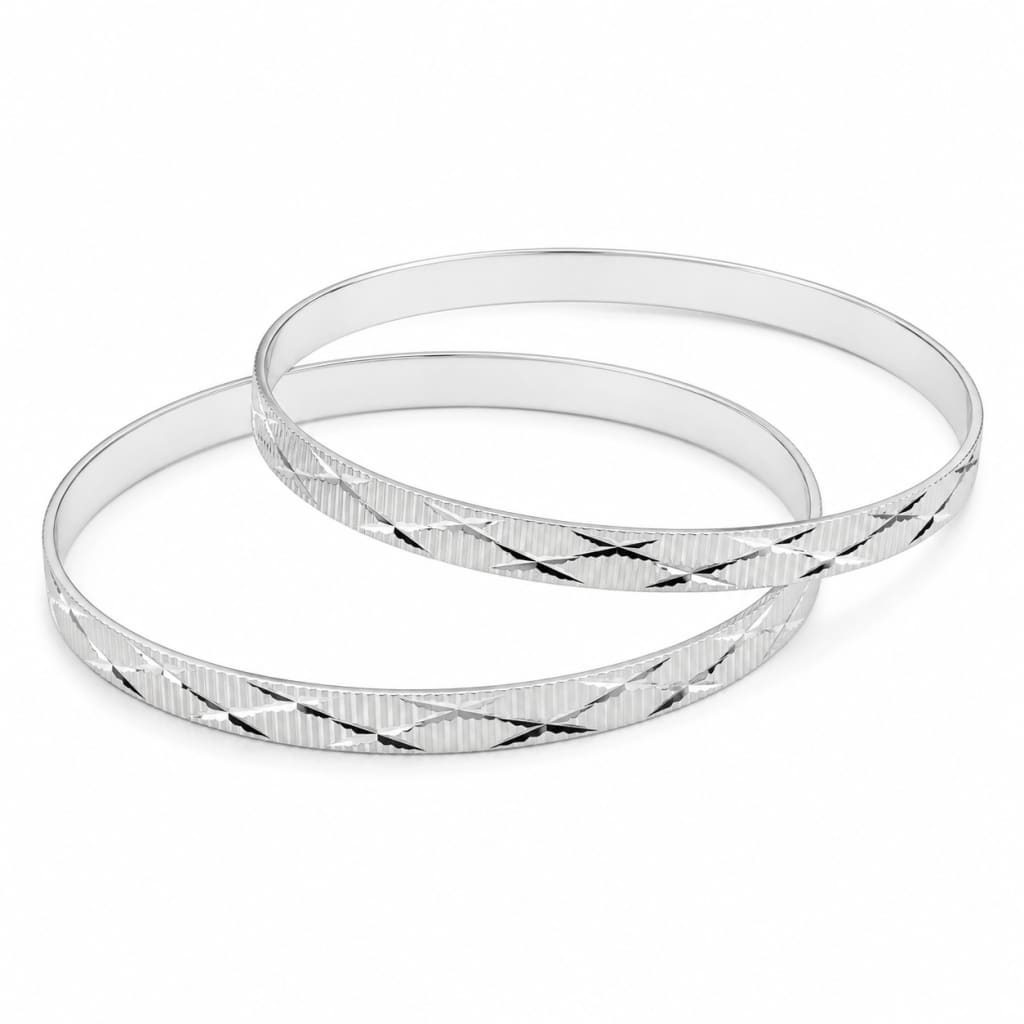 Pair of 925 sterling silver diamond-cut bangle bracelets, 63 mm