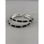 925 sterling silver kids bangle pair close-up showing black bead and silver accent pattern
