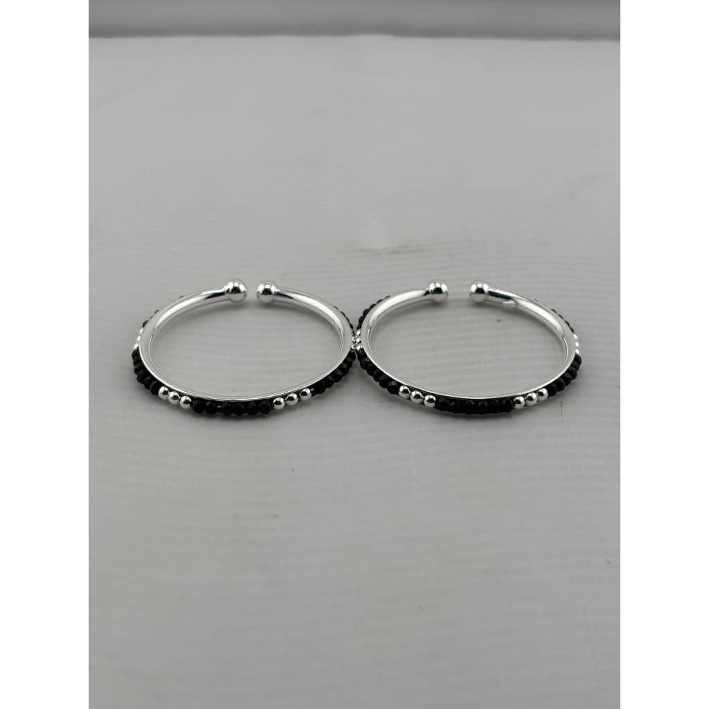 925 sterling silver kids bangle pair front view showing black bead pattern and silver accents