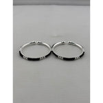 925 sterling silver kids bangle pair front view showing black bead pattern and silver accents
