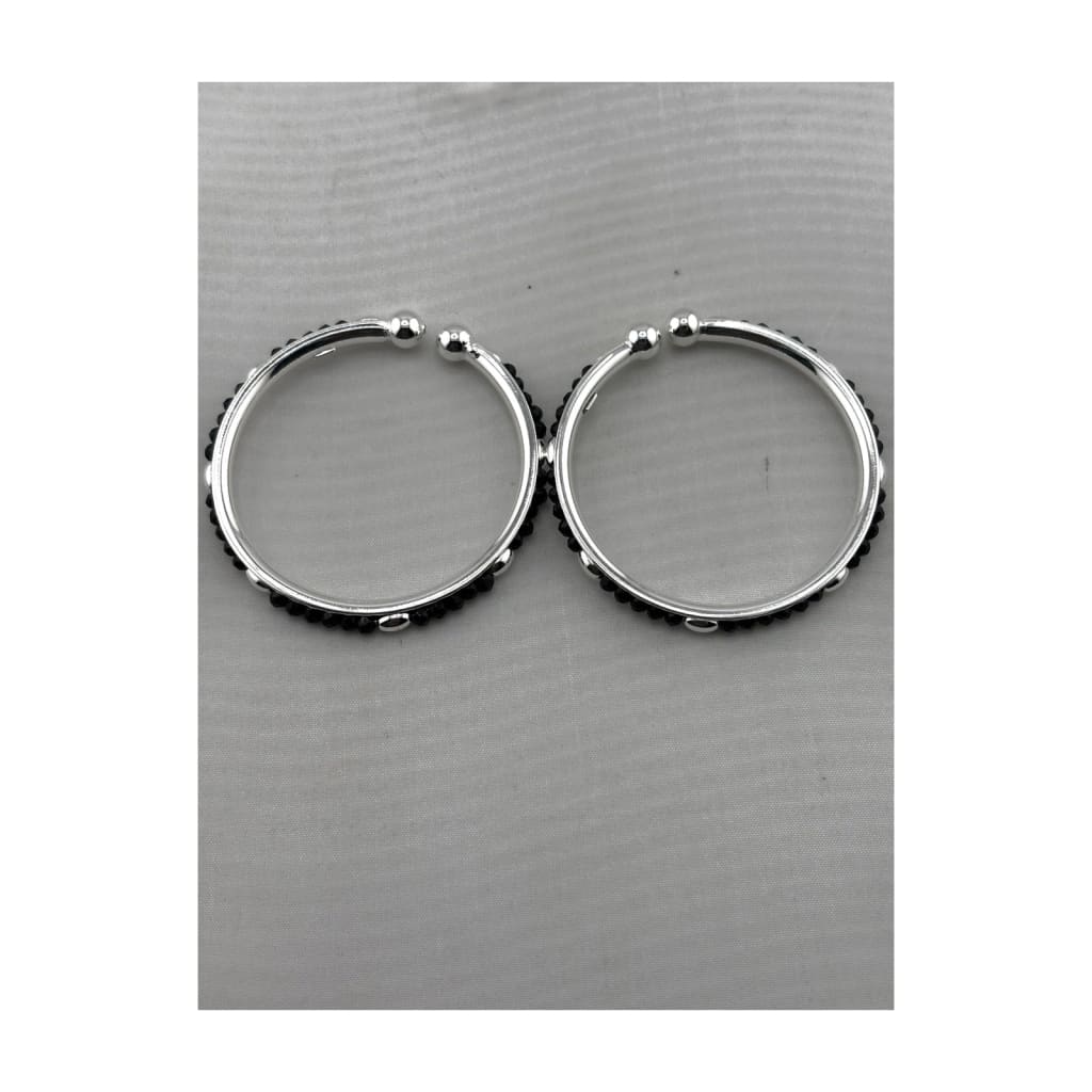 925 sterling silver kids bangle pair with black bead accents on pure white background