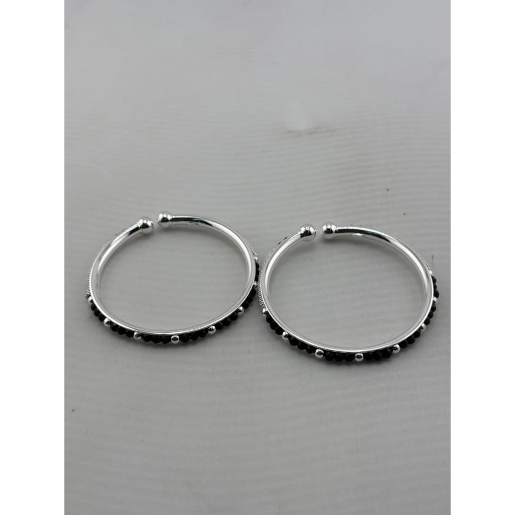 Original photo of silver kids black bead bangle pair