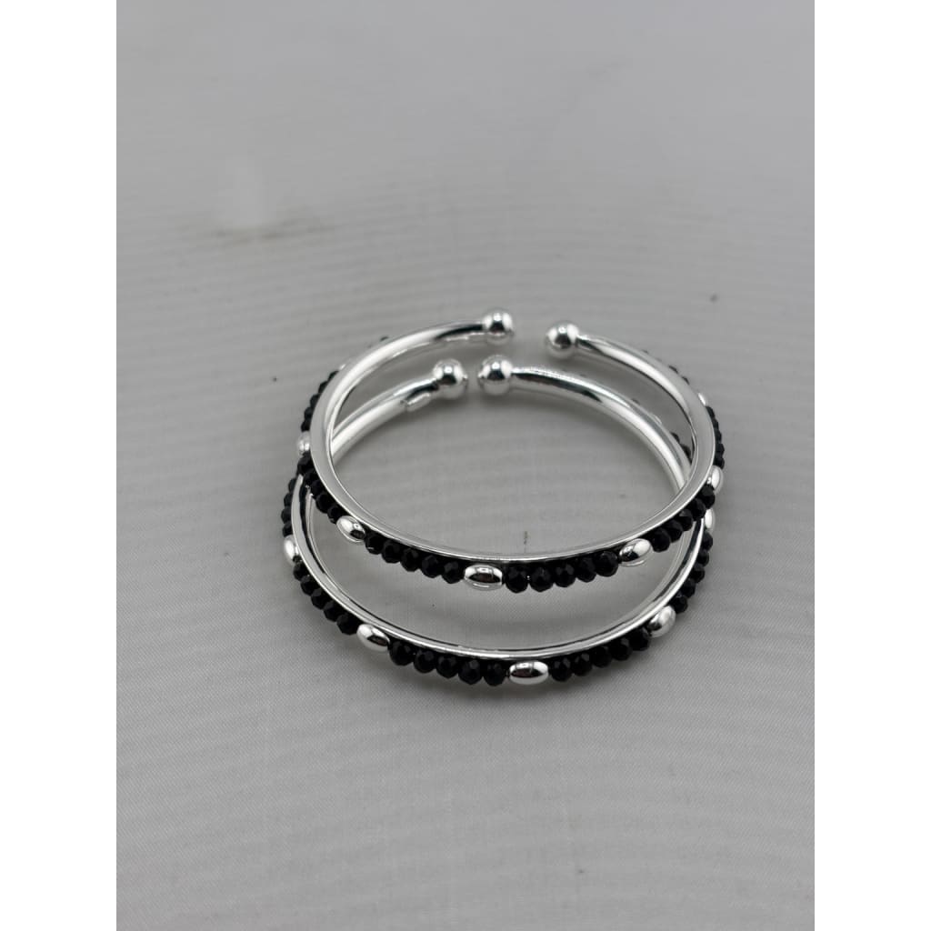 Kids silver bangle pair angled view