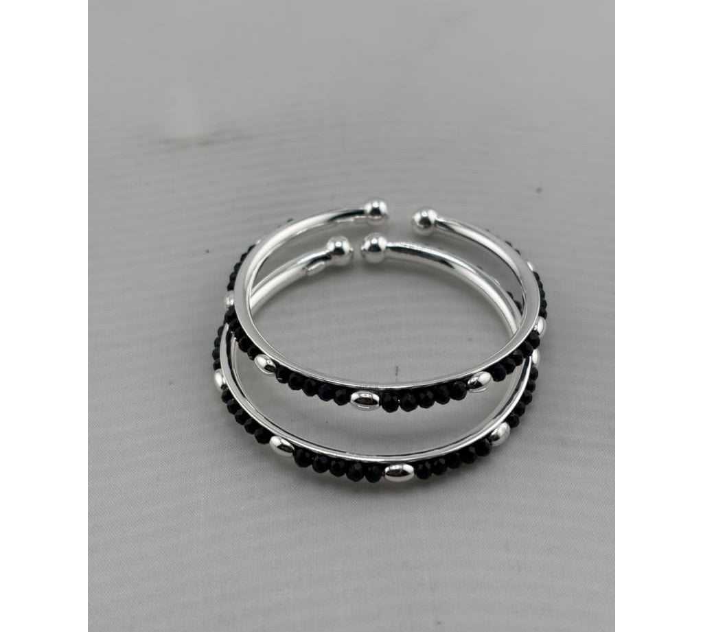 Kids silver bangle pair angled view