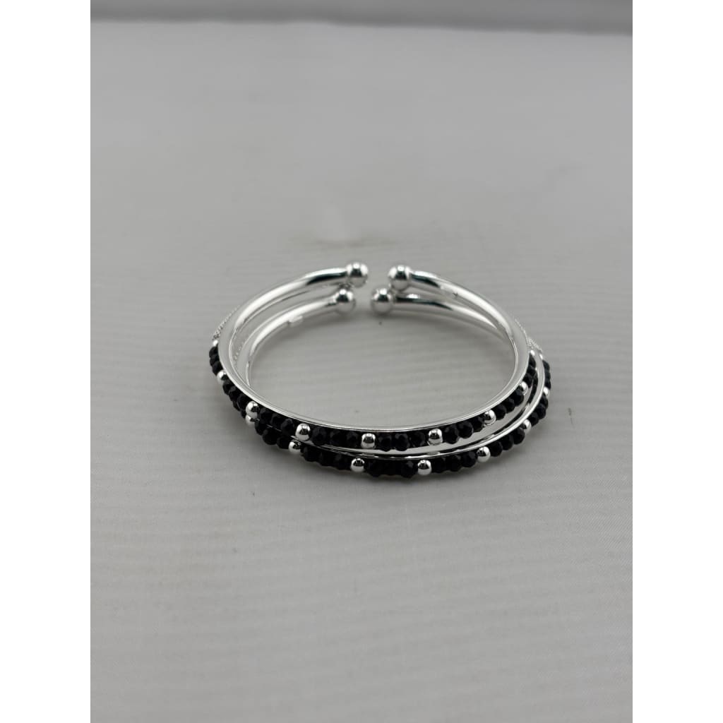Kids silver bangle pair angled view