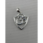 Close-up of a polished 925 sterling silver Om pendant in a shield-shaped frame