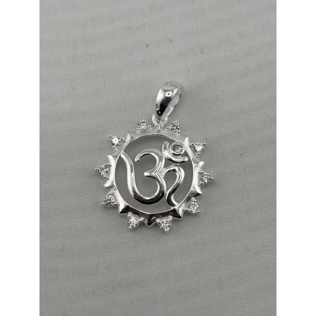 925 sterling silver Om pendant in a sunburst frame with clear crystal accents