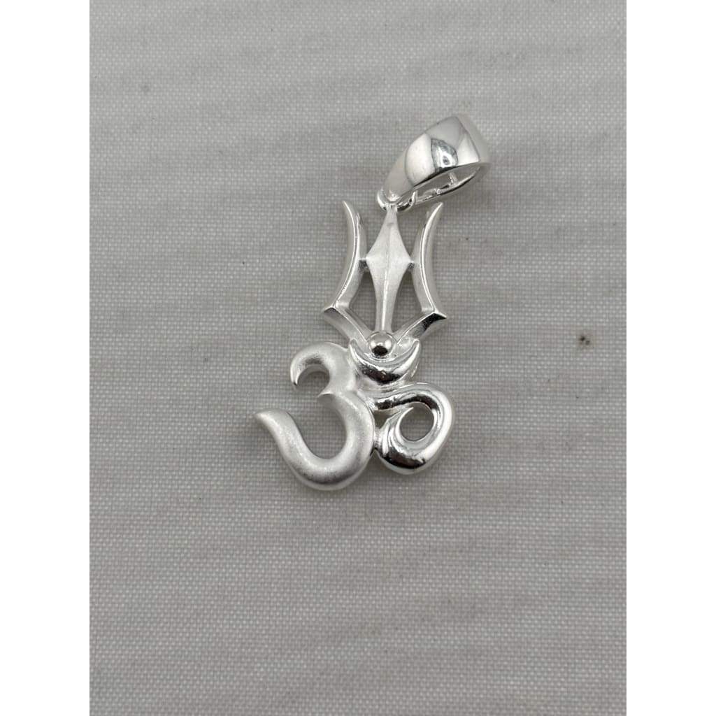Original close-up of a 925 sterling silver Om and trishul pendant