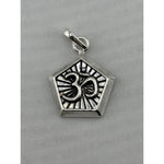 Original close-up of an oxidised silver Om pendant with pentagonal frame