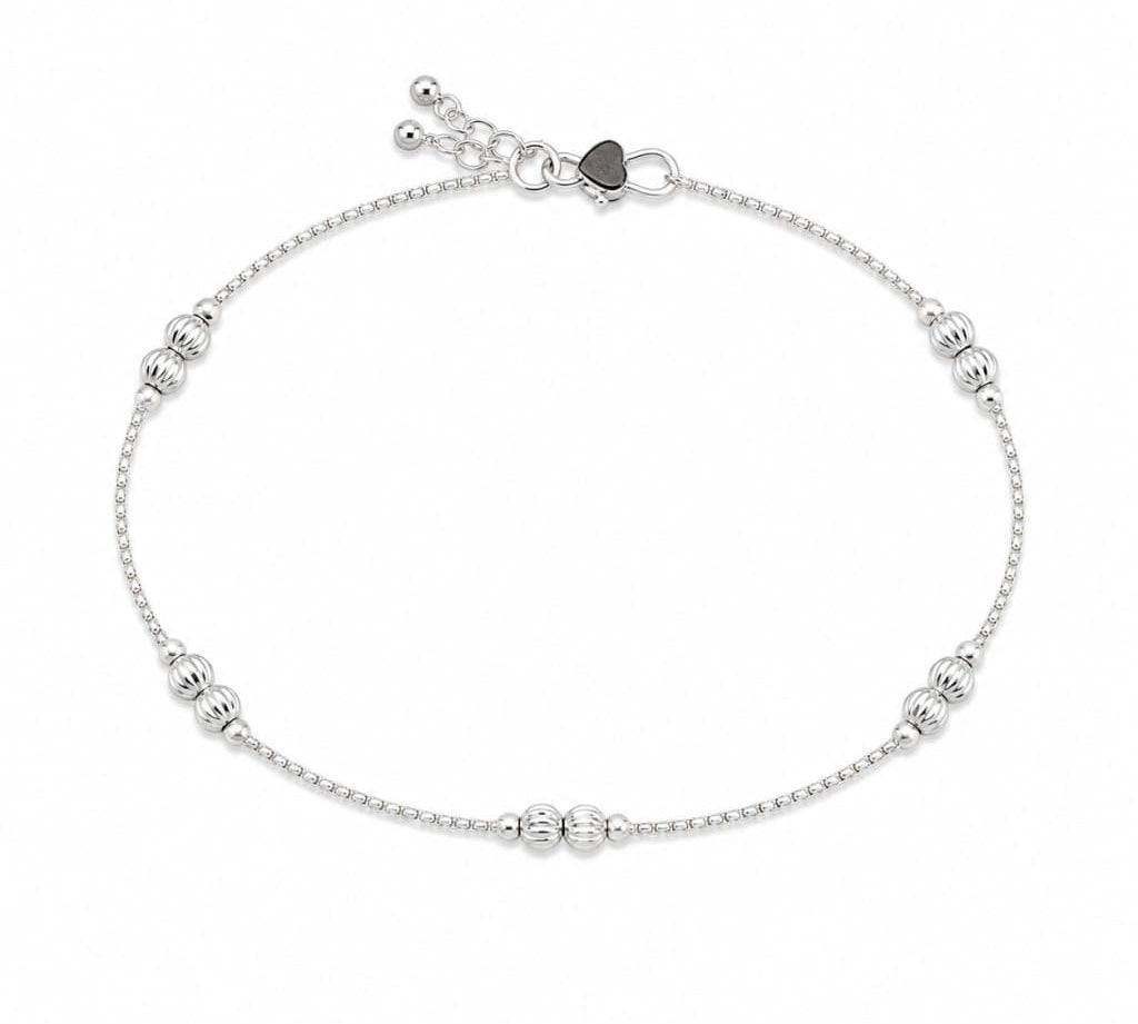 Single 925 sterling silver ribbed bead kids anklet on white background