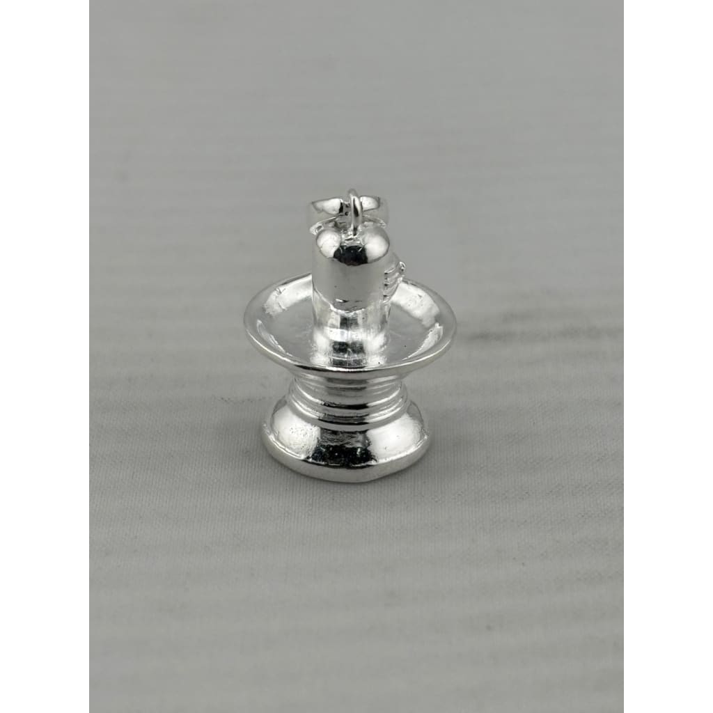 Original close-up of a polished silver Shiva lingam pendant