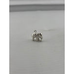 Original three-quarter view of a silver standing elephant pendant with curled trunk