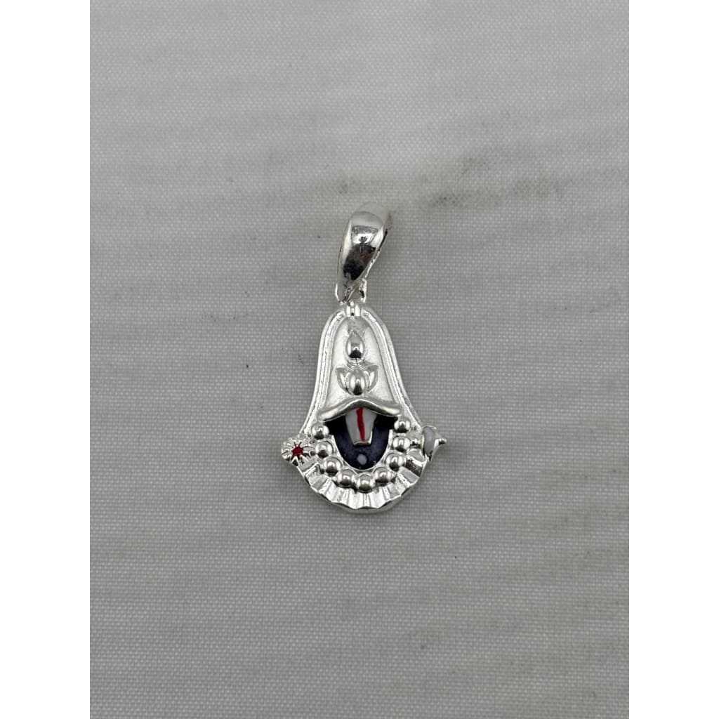 Original front view of a silver-tone Tirupati Balaji face pendant with black, white, and red details
