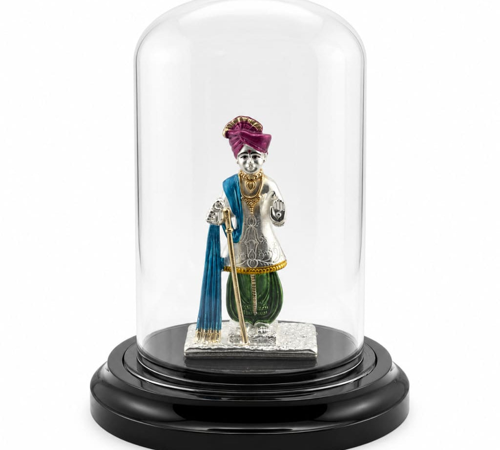 999 pure silver Swaminarayan idol in protective acrylic dome