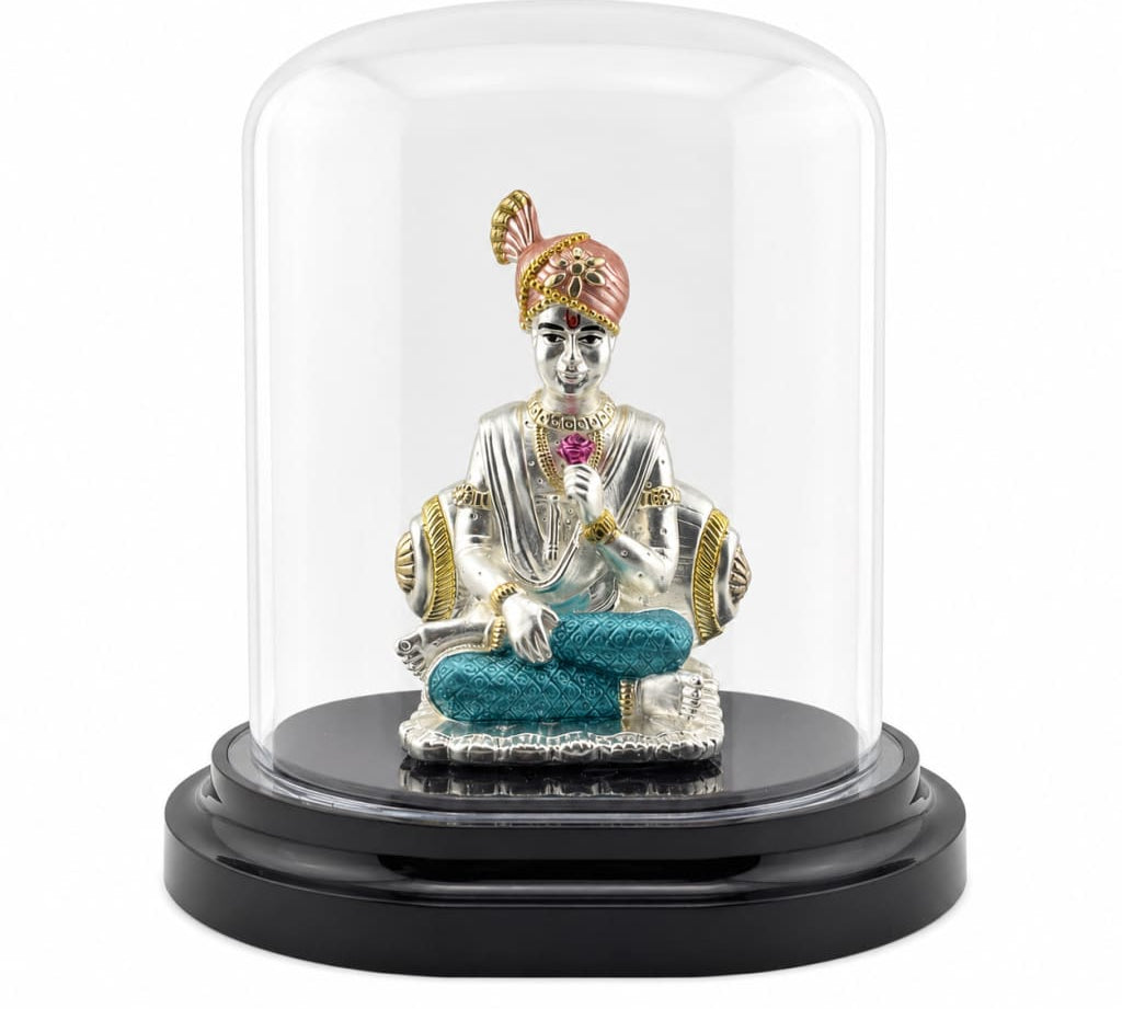 999 pure silver Swaminarayan idol in acrylic dome
