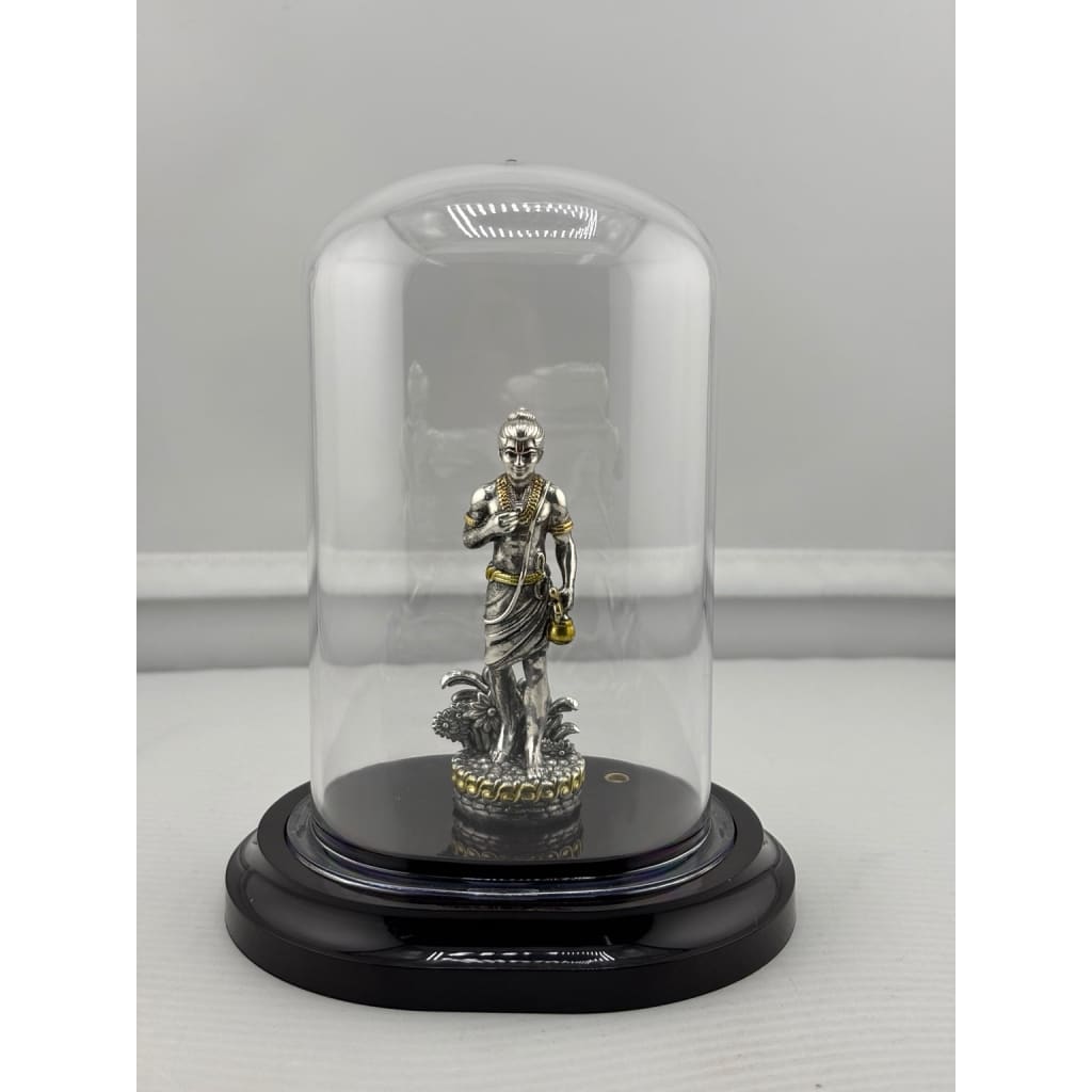 Swaminarayan silver idol in protective dome front view