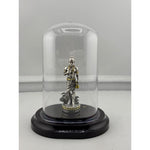 Swaminarayan silver idol in protective dome front view