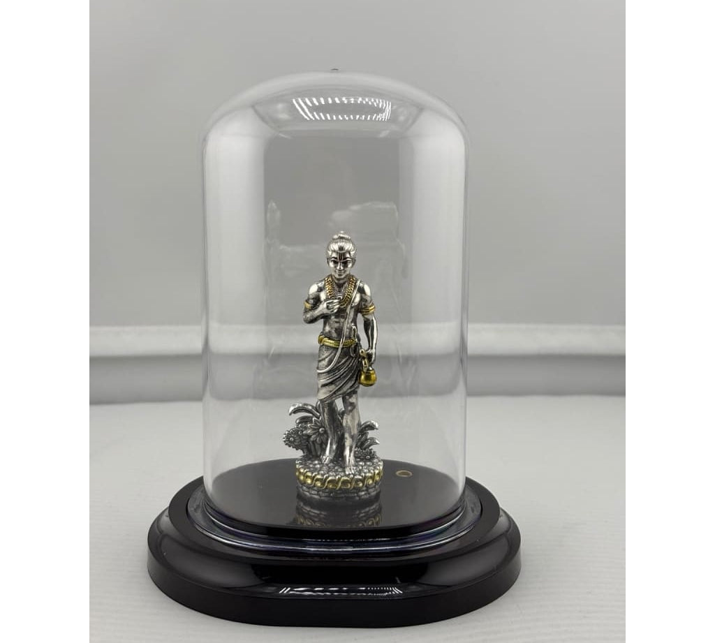 Swaminarayan silver idol in protective dome front view
