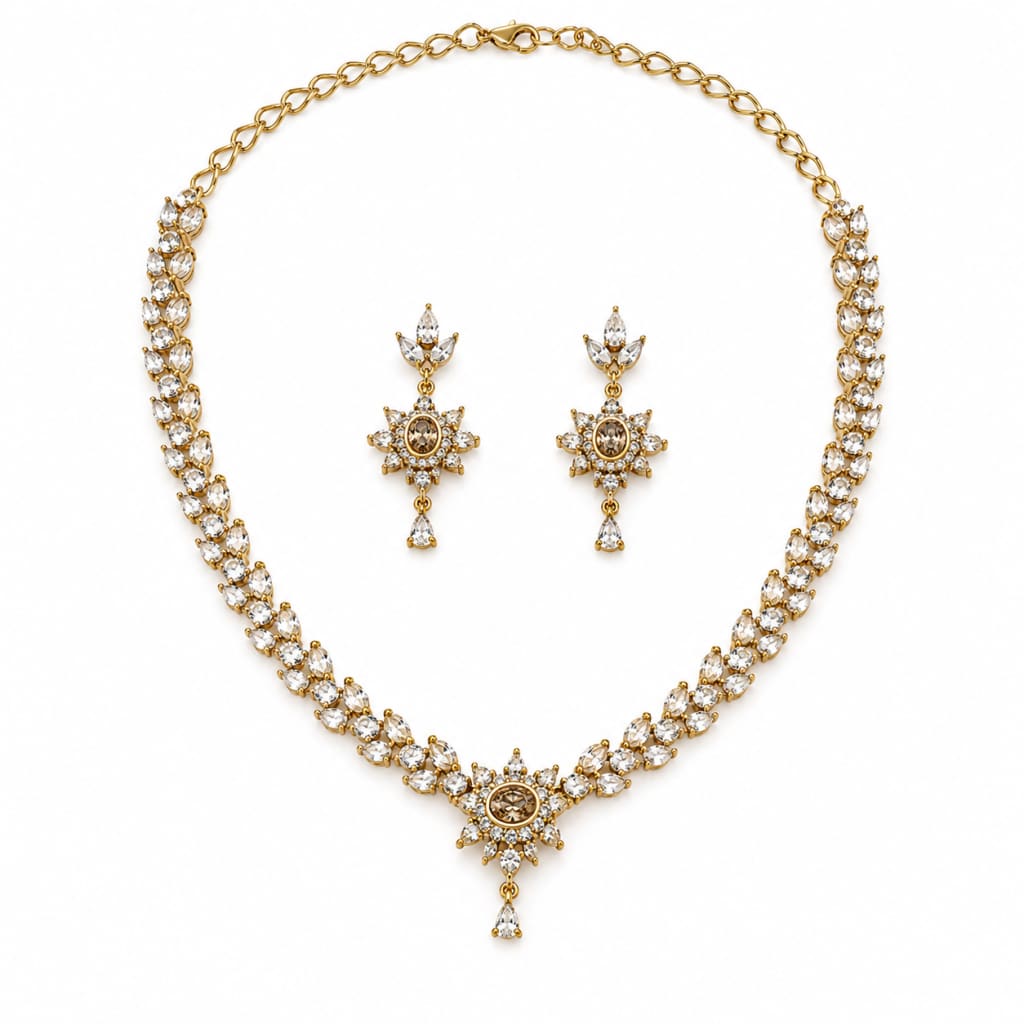Gold-plated 925 sterling silver crystal necklace and matching earrings set on pure white background