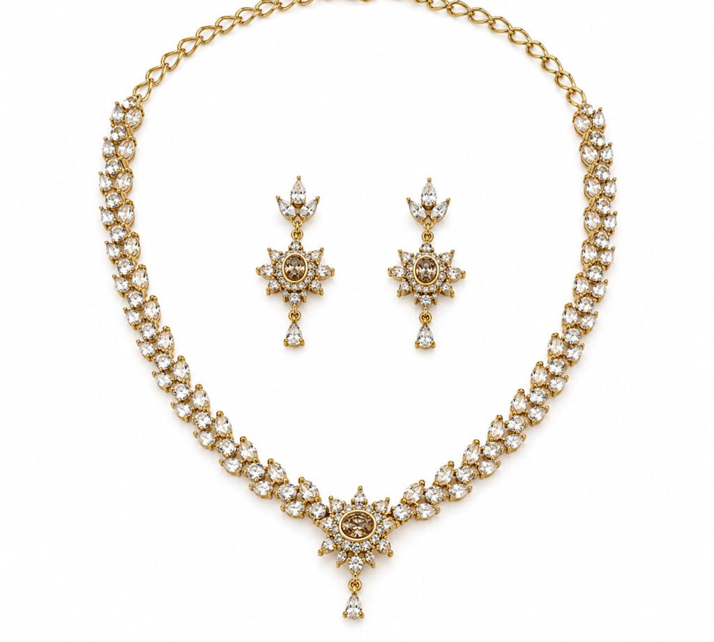 Gold-plated 925 sterling silver crystal necklace and matching earrings set on pure white background