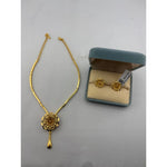 Gold-plated layered flower pendant necklace with matching stud earrings