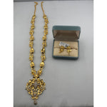 Gold-plated ornate floral statement necklace and matching earrings set