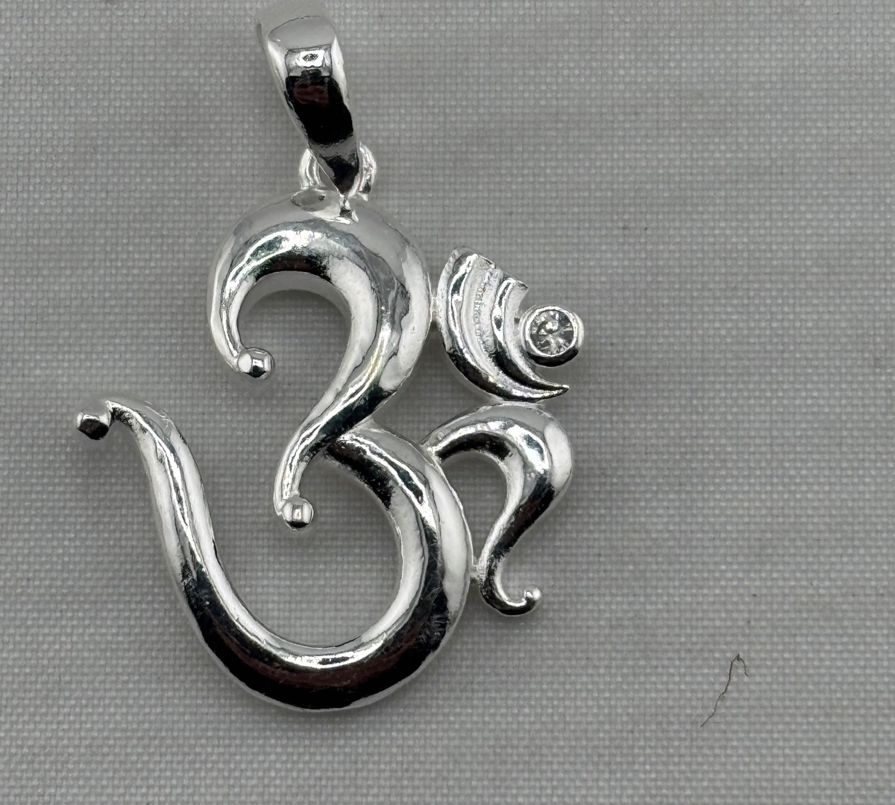 Polished 925 sterling silver Om pendant with crescent and clear crystal detail
