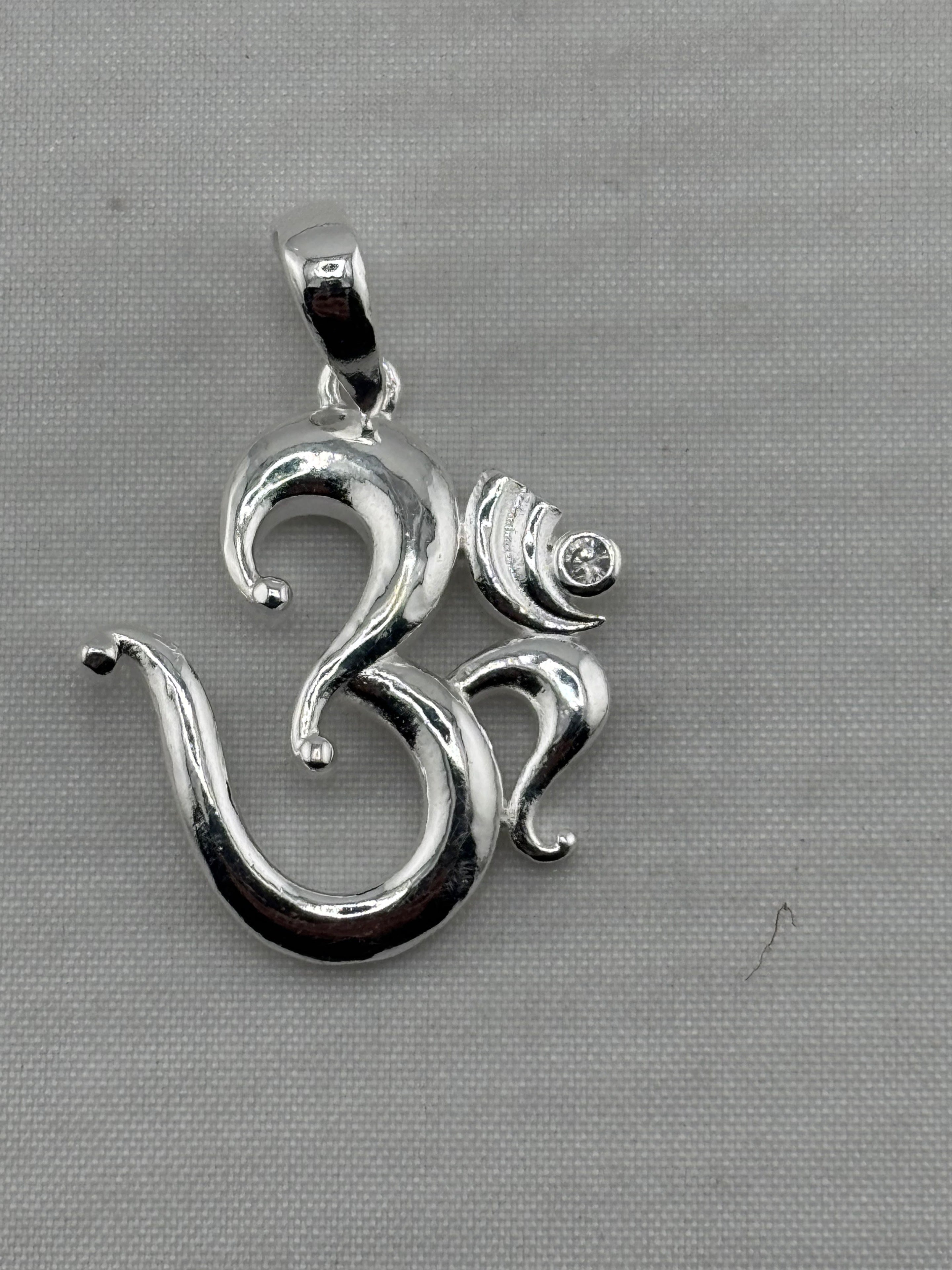 Polished 925 sterling silver Om pendant with crescent and clear crystal detail